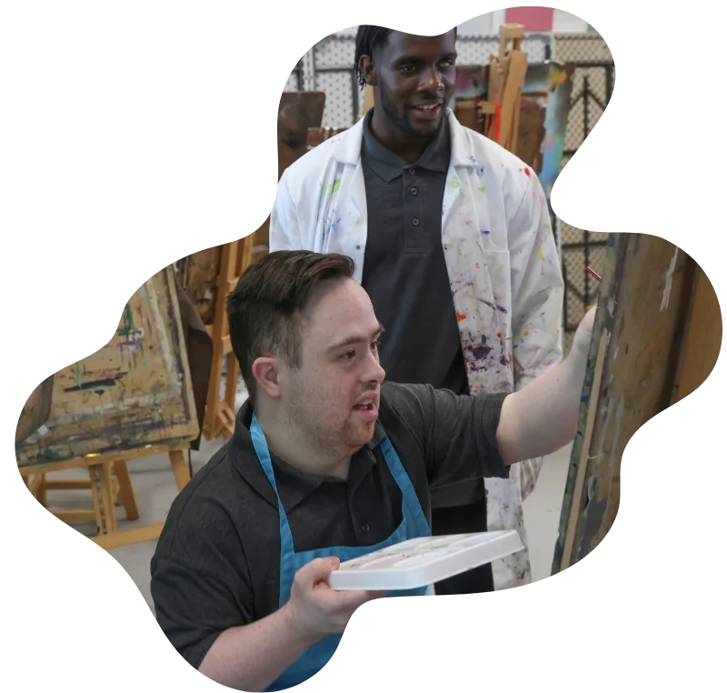 Two disabled friends in a painting class