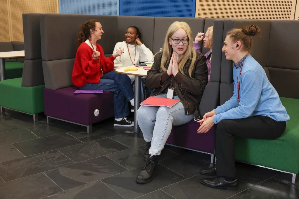 Support worker talking with disabled person